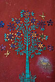 Luang Prabang, Laos - Wat Khili, on the side of the entrance the sim is decorated with glass mosaics of trees.